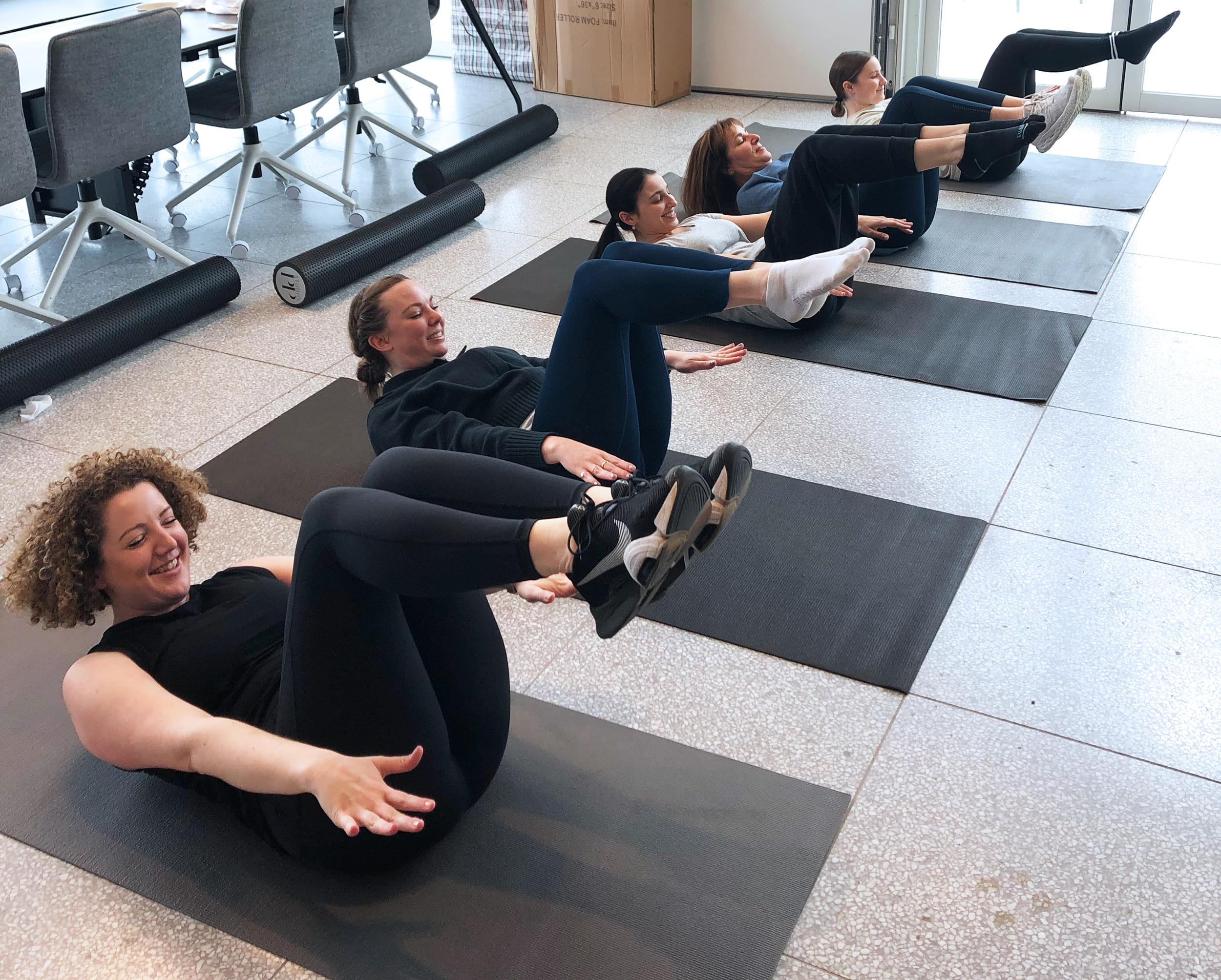 team members during a pilates class