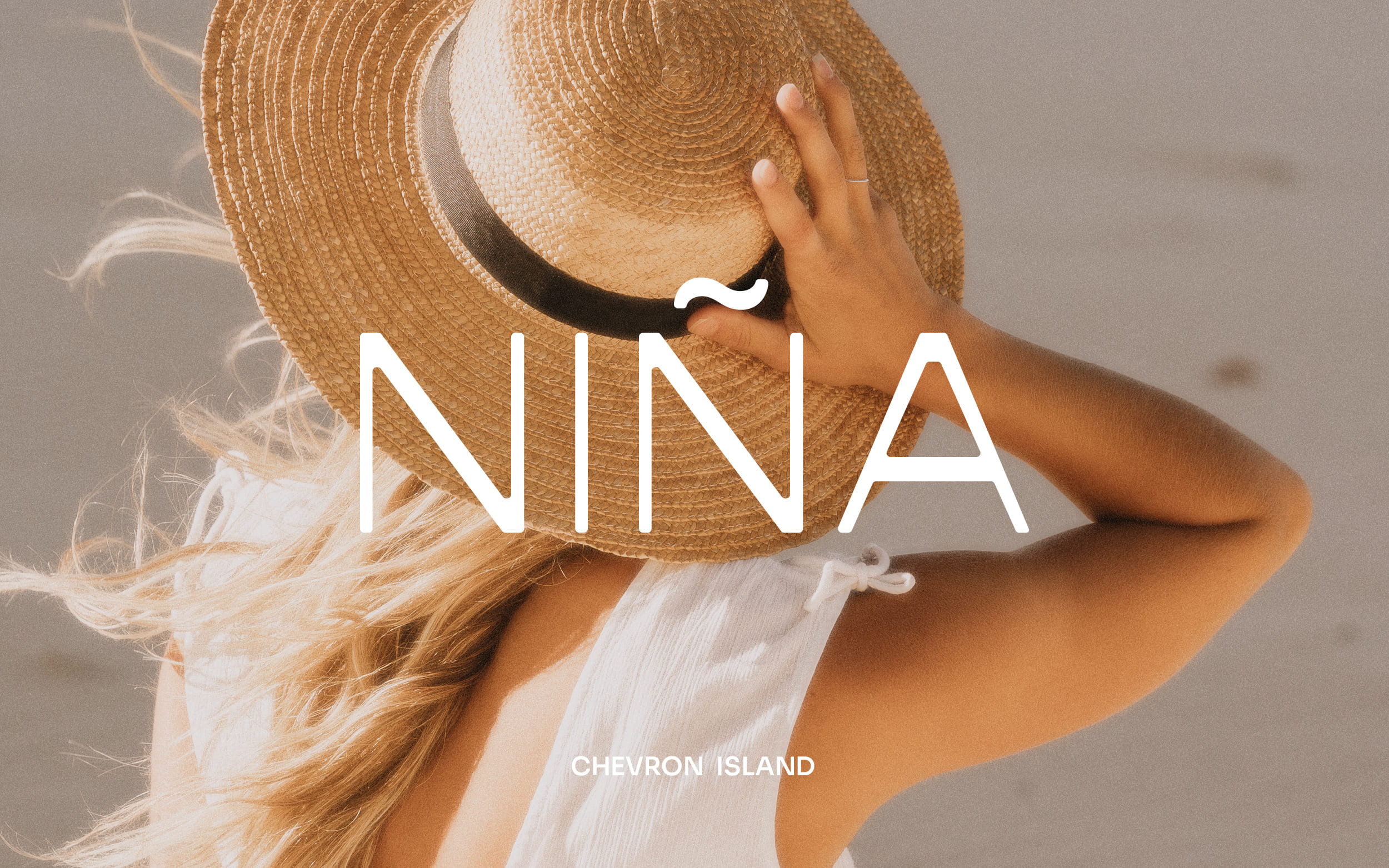 Nina branding over woman in sunhat and white dress