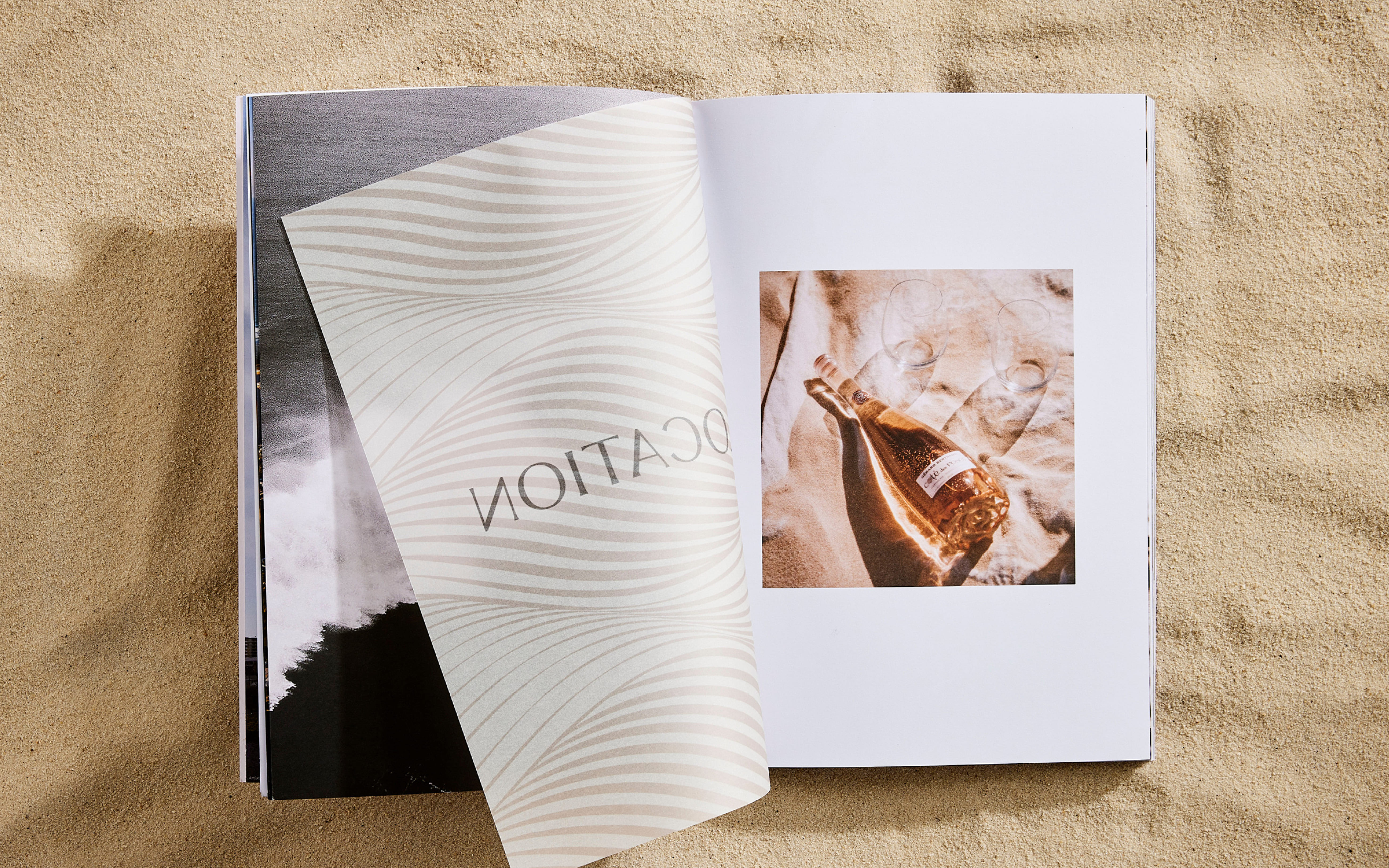 Nina brochure spread showing image of champagne and glasses on beach