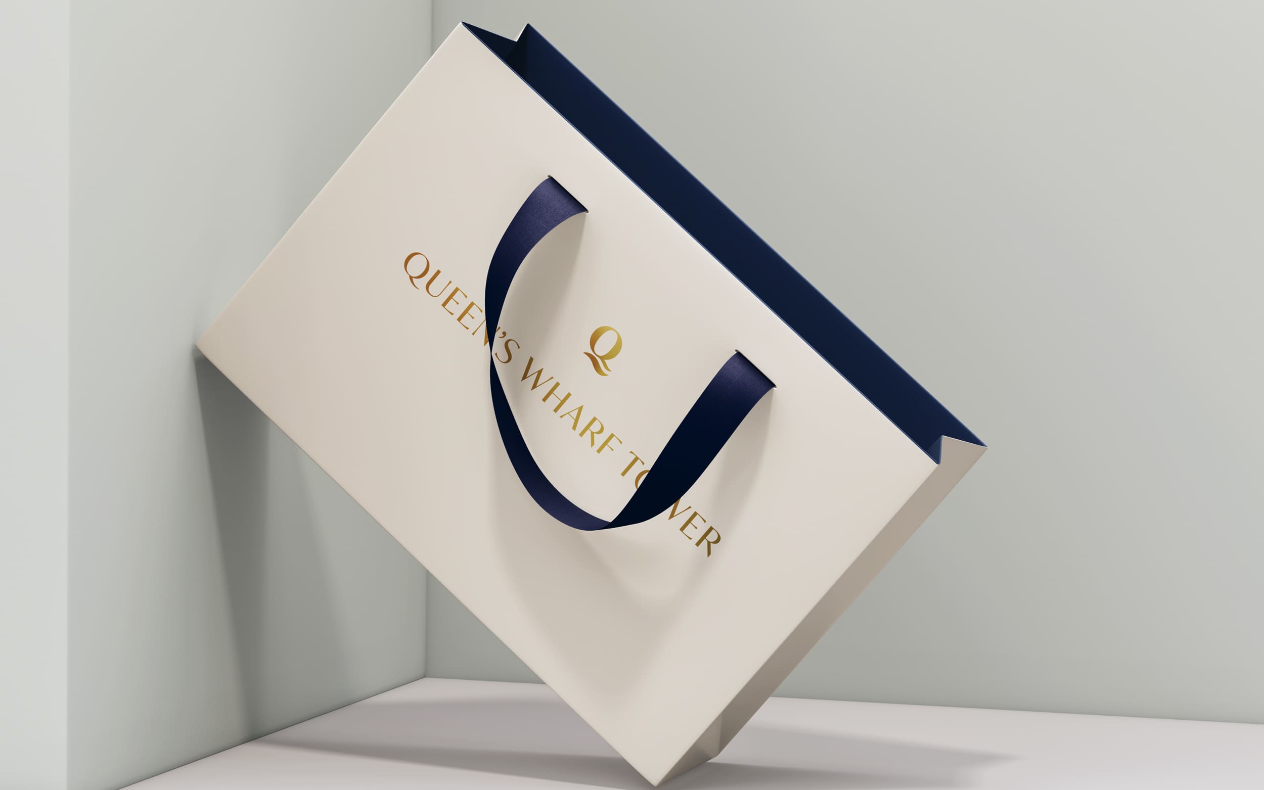 Cream shopping bag with Queen's Wharf Tower branding