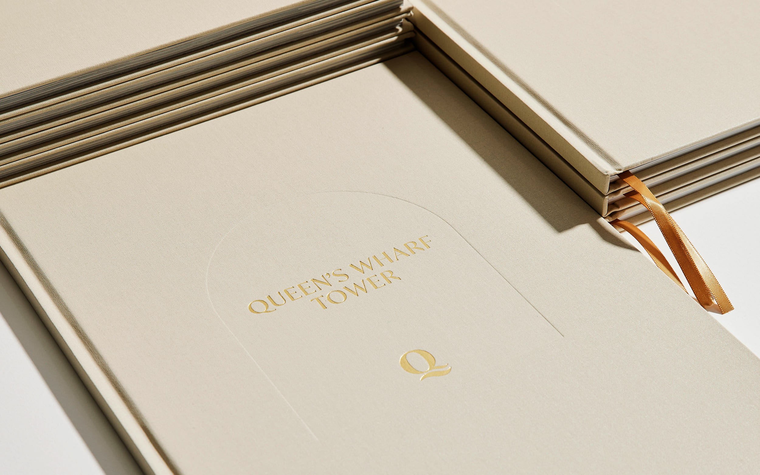 Queen's Wharf Tower brochure cover with gold foil and deboss