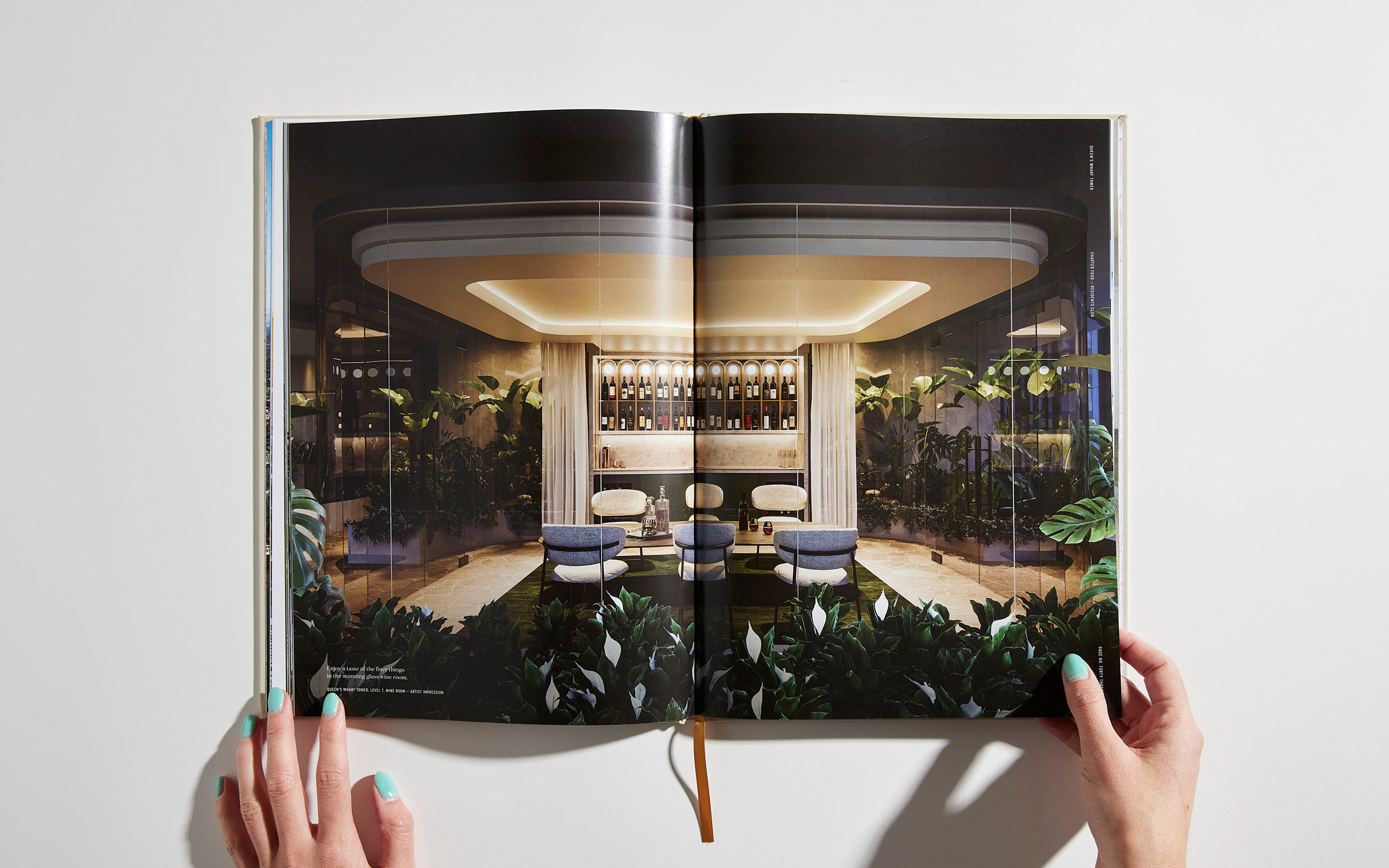Queen's Wharf Tower brochure spread - DPS image of glass-walled wine bar