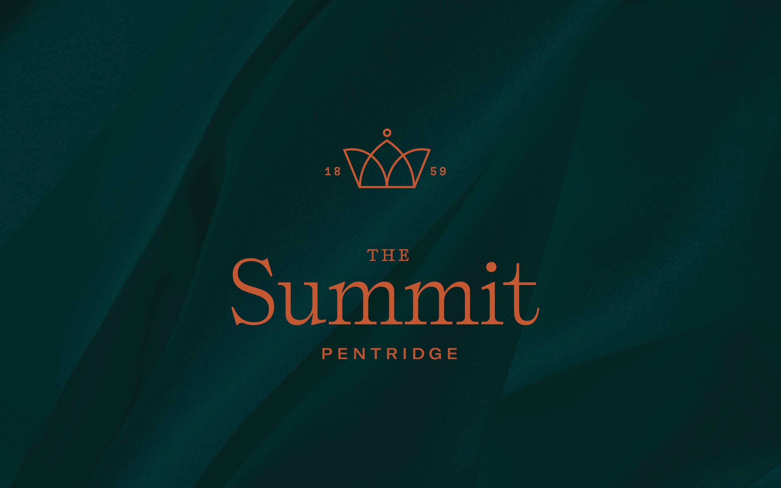 The Summit logo on green fabric background