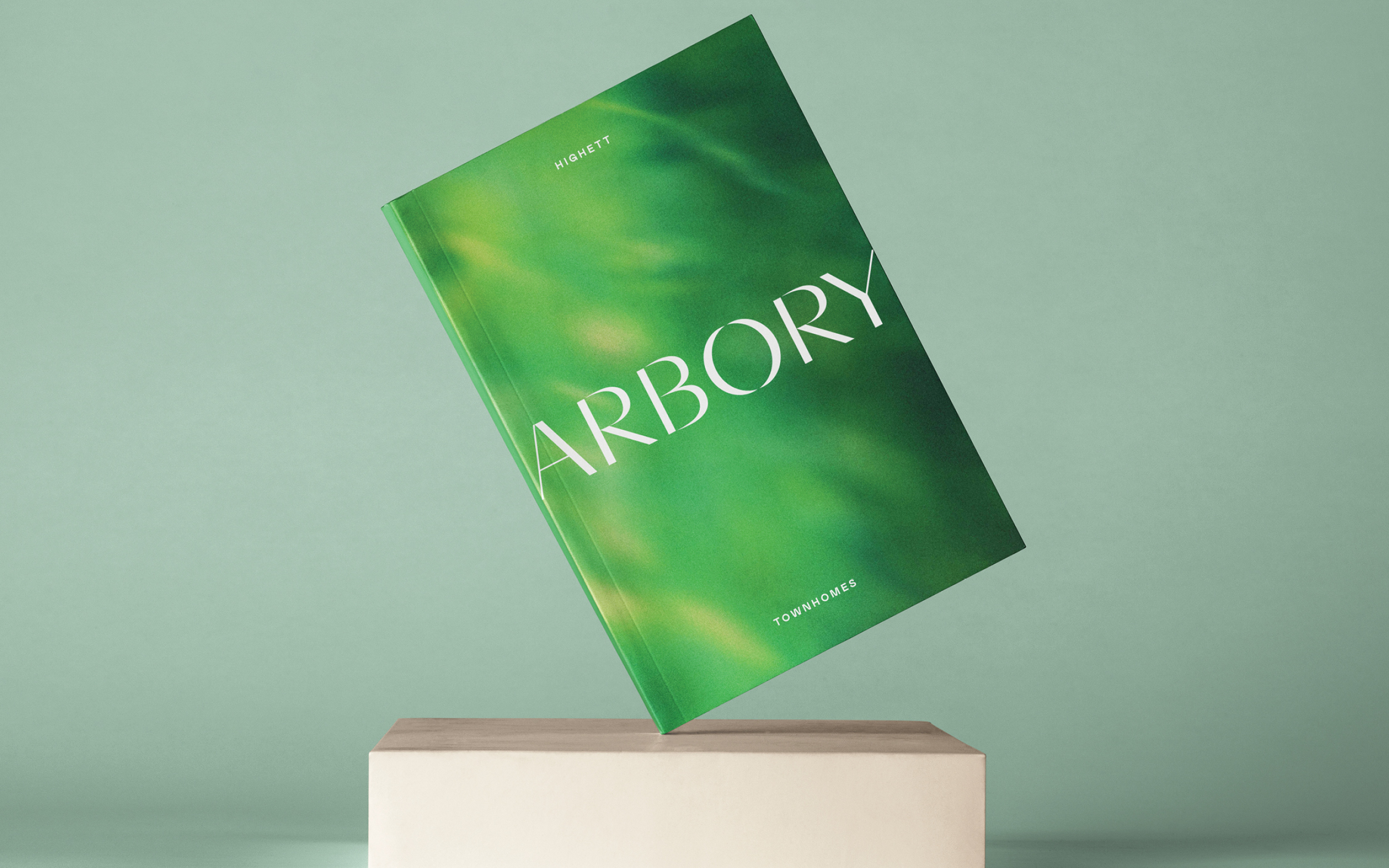 Brochure cover - Arbory logo on blurred greenery