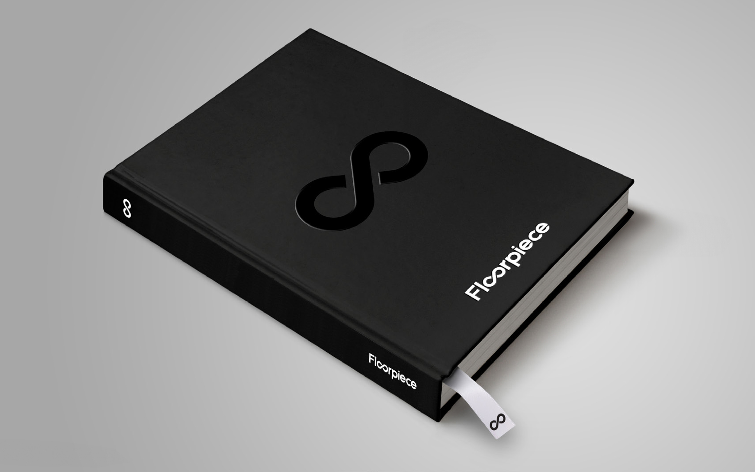 Black lookbook with infinity symbol graphic on cover